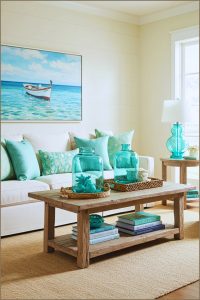 Coastal Living Room With White Sofa And Mint Green Throw Pillows