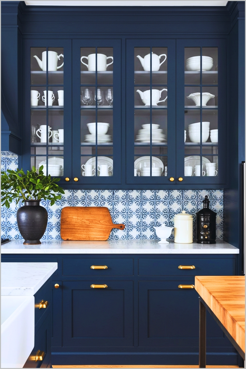 Elegant Kitchen With Navy Blue Cabinets And Gold Hardware Glass Front Upper