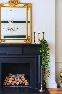 Elegant Traditional Mantel With A Grand Gold Ornate Mirror