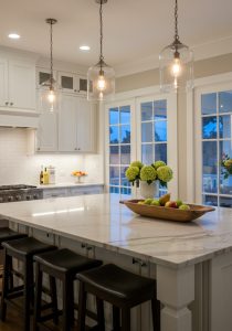 Evening-glow Classic White Kitchen Island Vignette, Long Veined Carrara Marble Waterfall Island With Soft Reflective Sheen