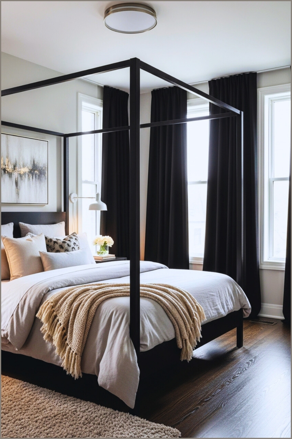 Chic Bedroom Makes A Bold Statement With A Sleek Black Canopy Bed Framed