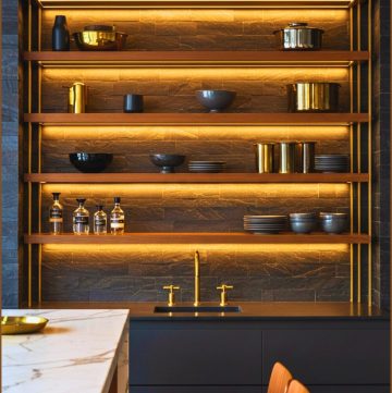 Modern Kitchen Dark Stone Tiles Gold Accented Shelving