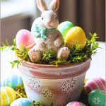 Adorable Easter Bunny Figurine Sitting In A Decorative Pot