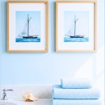 Coastal Bathroom Vignette Featuring Two Framed Sailboat