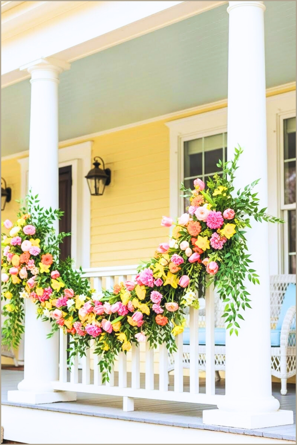 Colorful Spring Flower Garland Draped Over White Porch
