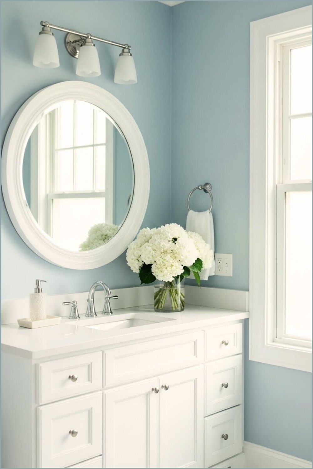 Fresh Soft-blue Bathroom With White Vanity