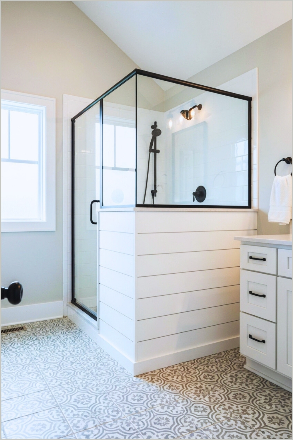 Modern Farmhouse Bathroom With Patterned Grey And White Floor Tiles