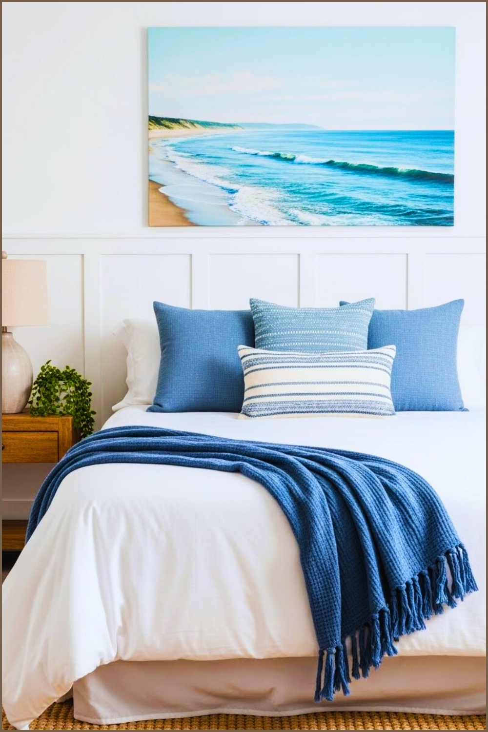Airy Coastal Bedroom Interior White Bedding With Layered Blue Throw Blanket