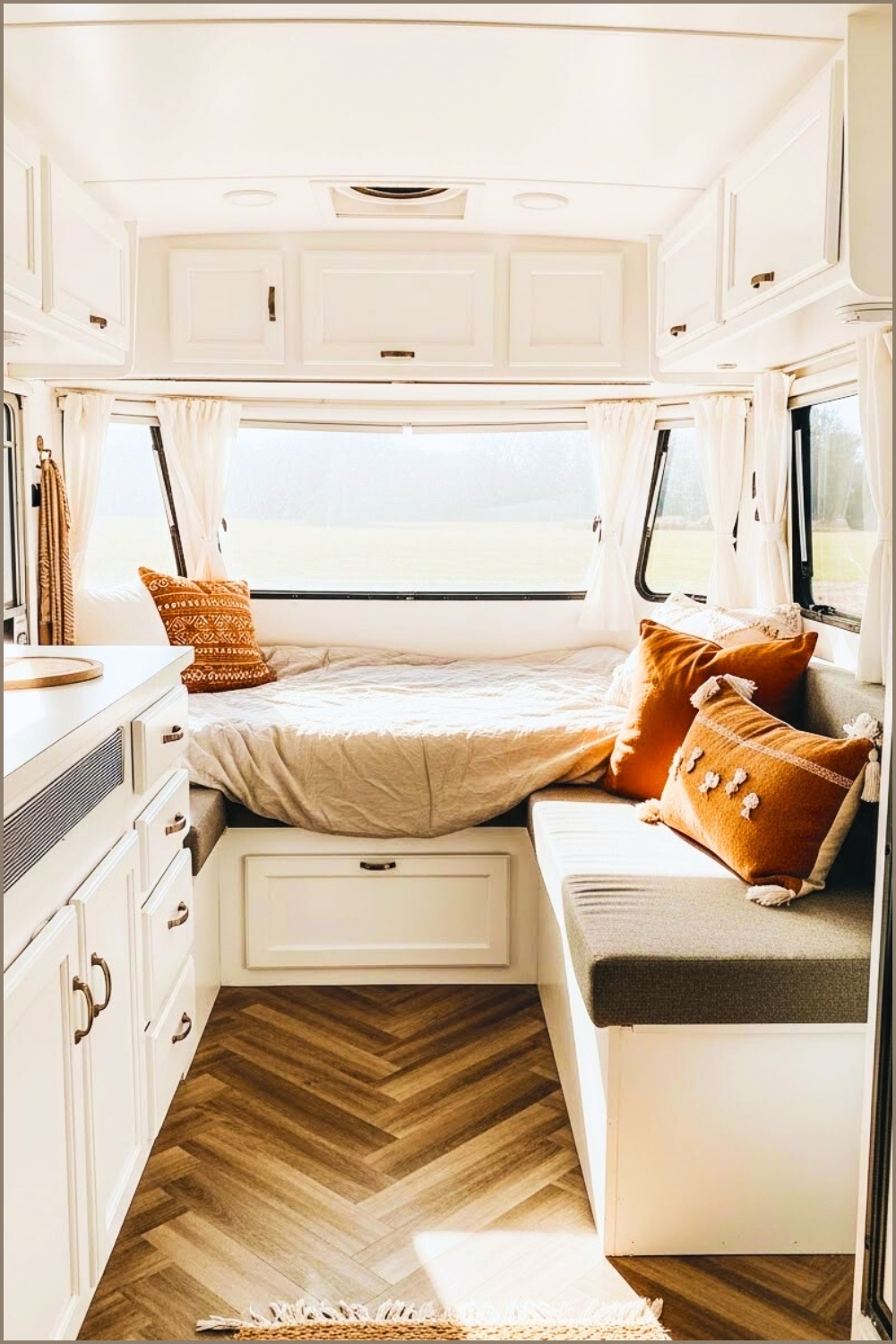 Bright Airy Camper Interior White Cabinetry Herringbone Wood Flooring