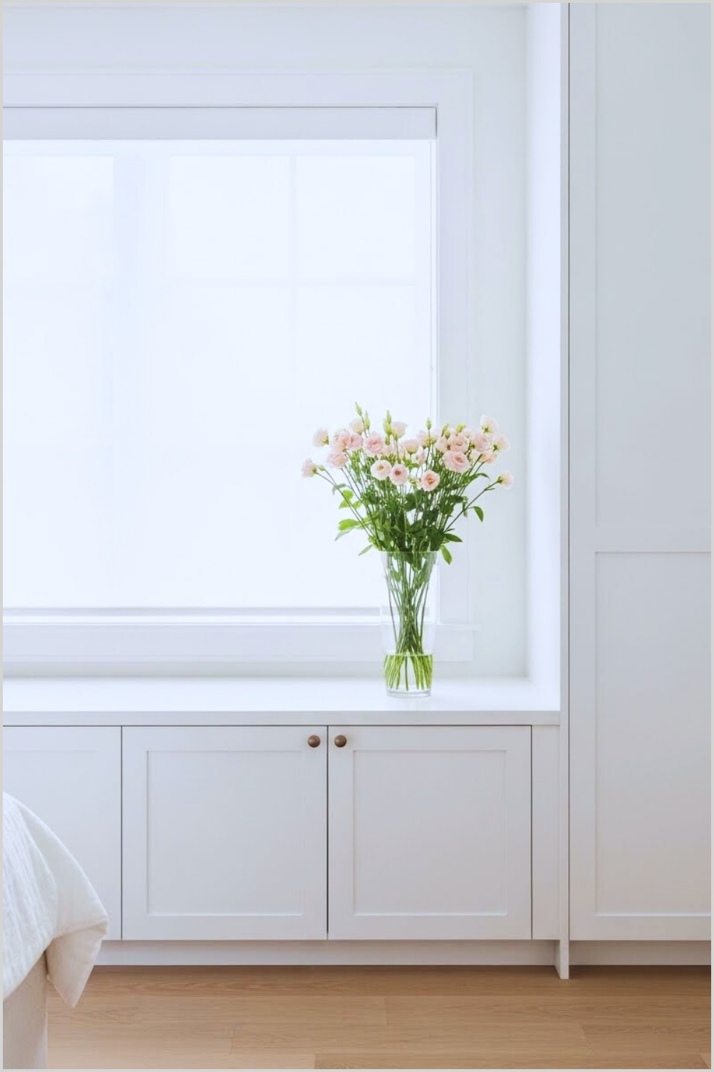 Minimalist White Built In Cabinet Under Window