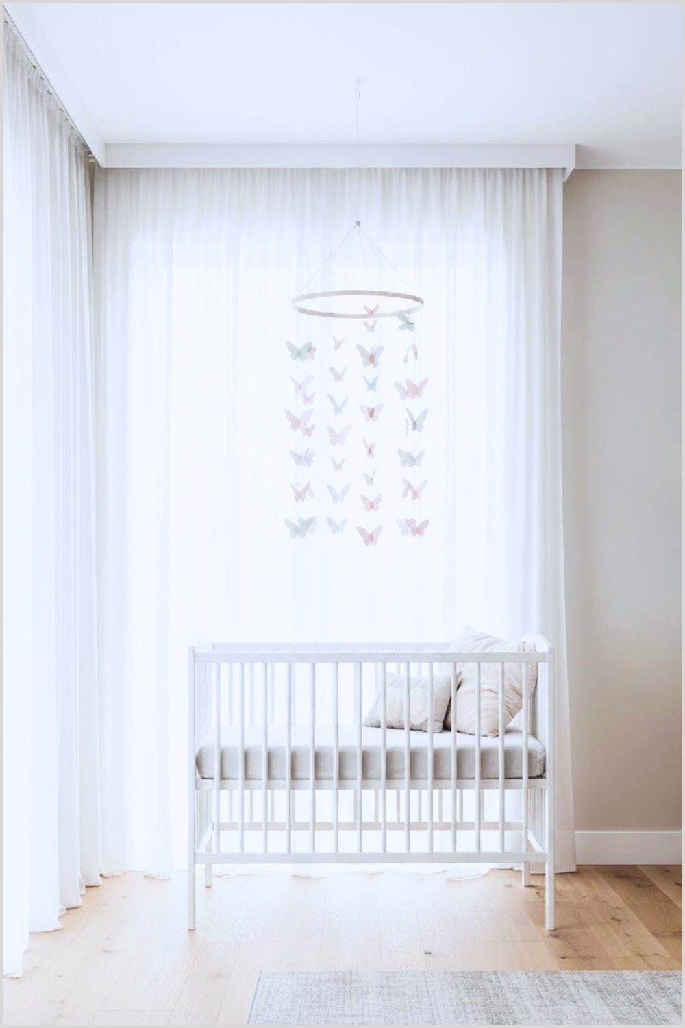 Minimalist Butterfly Themed Nursery With A Soft White