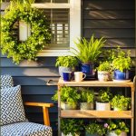Small Cozy Porch With Rolling Wooden And Metal Plant Cart