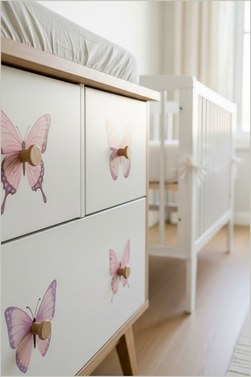 Soft Pastel Butterfly Nursery Detail With White Wooden