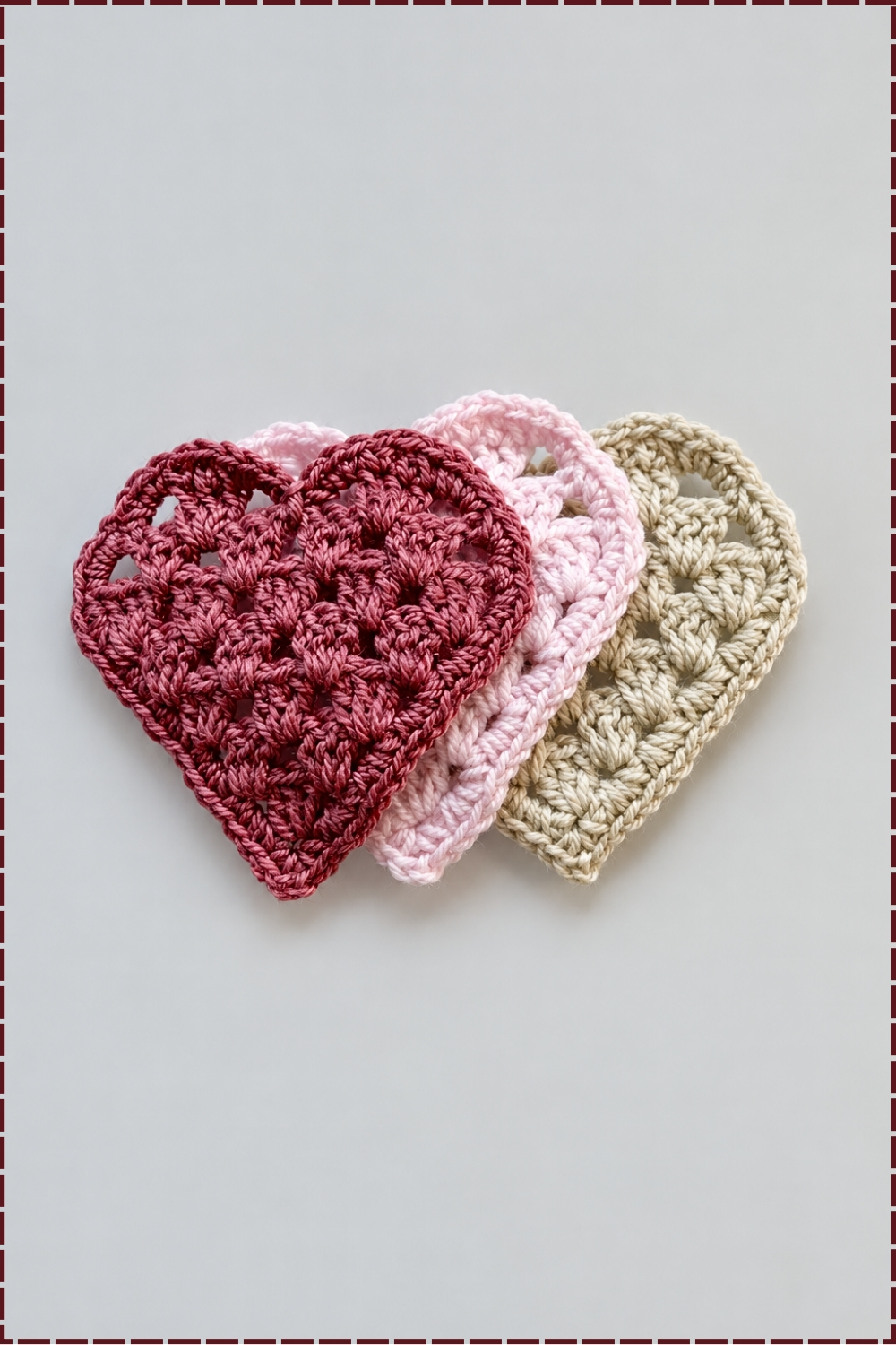 enhance this photo that looks like ( 64K DSLR shot resolution of a ultra-hyperrealistic ) Enhance the uploaded crochet reference image while keeping its original colors, tones, and lighting exactly the same. Make the image clearer, sharper, and more realistic — improving visibility, texture detail, and definition of the yarn without altering hue or saturation. Emphasize natural fiber realism and surface clarity (avoid blurring or oversmoothing). Maintain the exact composition and proportions of the object. The result should look clean, bright, and high-quality — perfect for Pinterest display or pattern previews. Crochet Easy Colorful Granny Heart Coasters